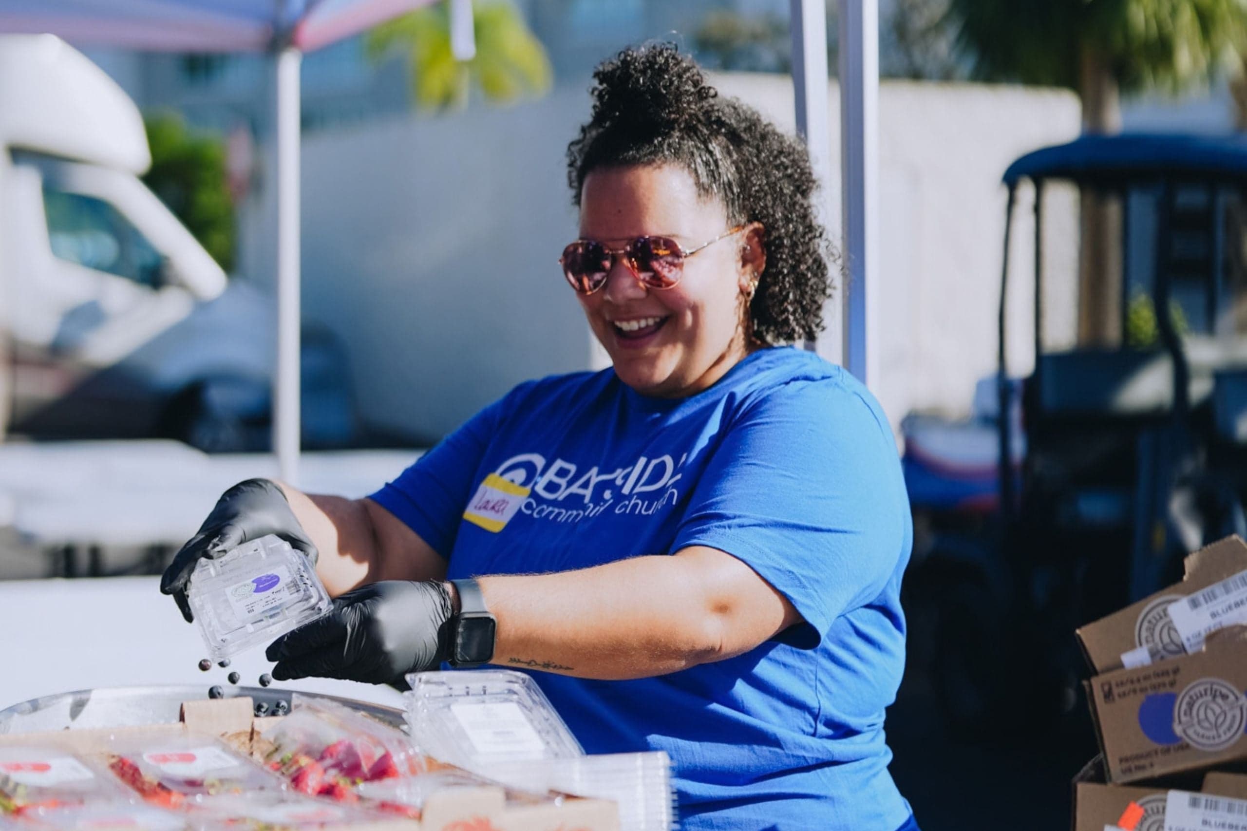 Volunteer helps prepare fruit