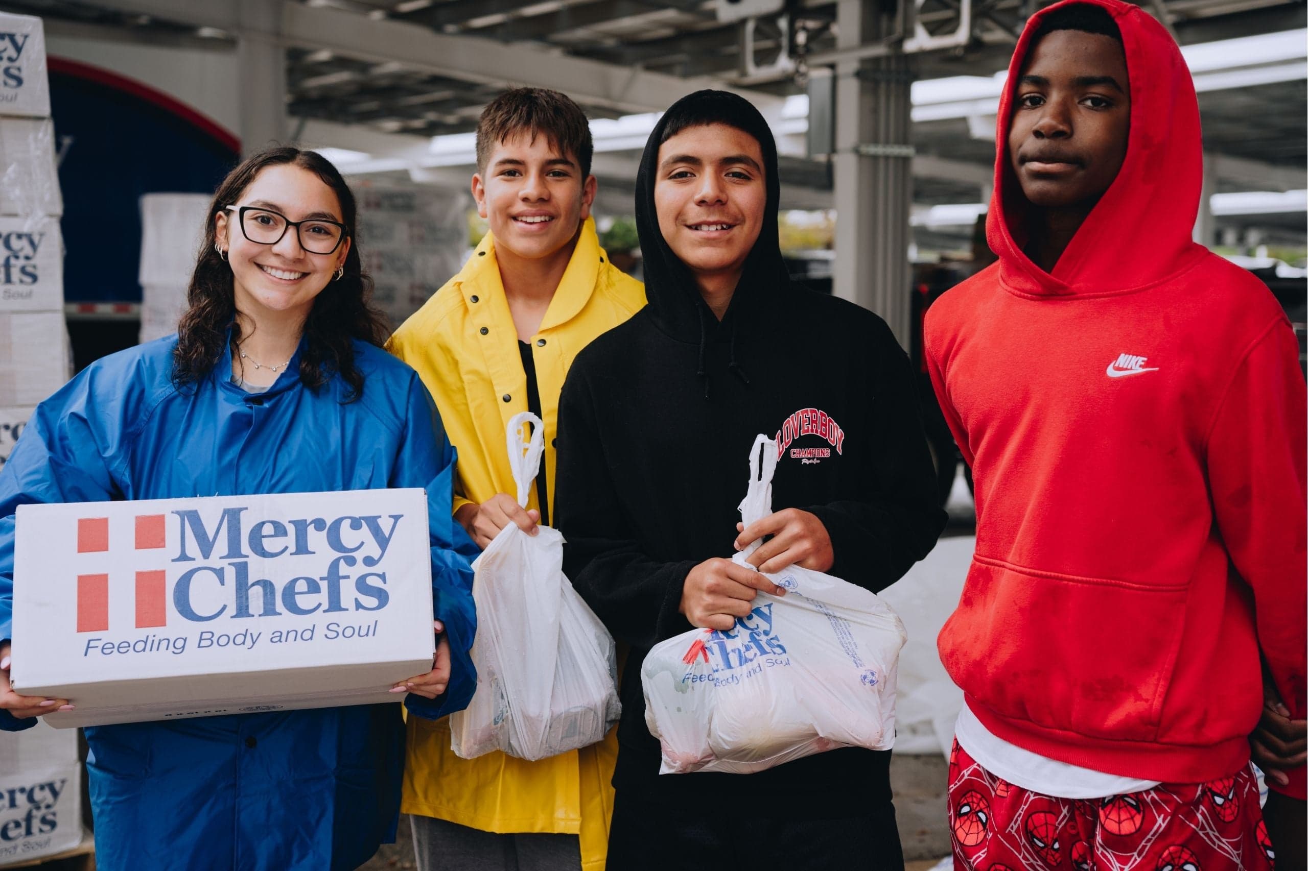 A group of teens receive hot meals and Family Grocery Boxes in Kerrville, Texas.