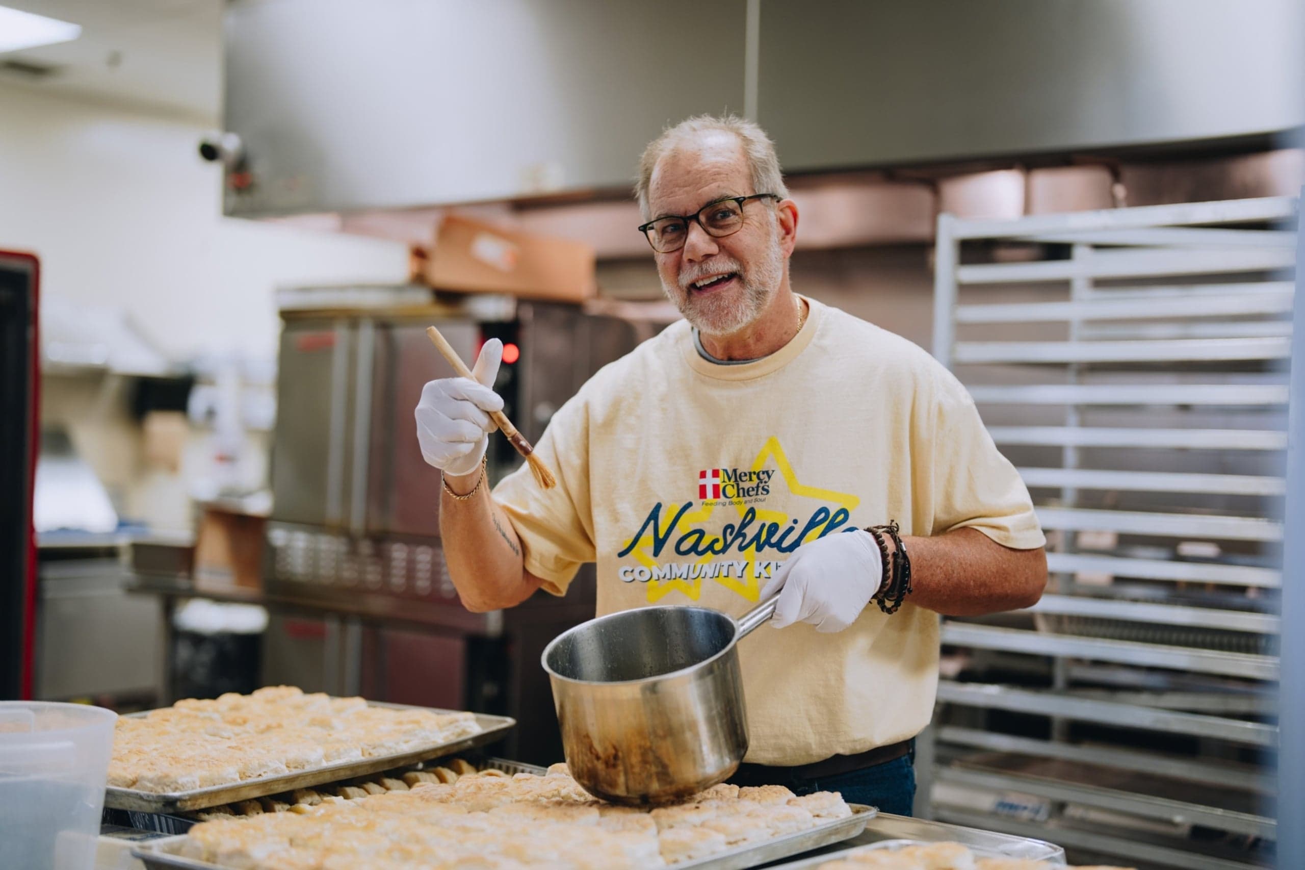 Nashville Community Kitchen volunteer preparing bread