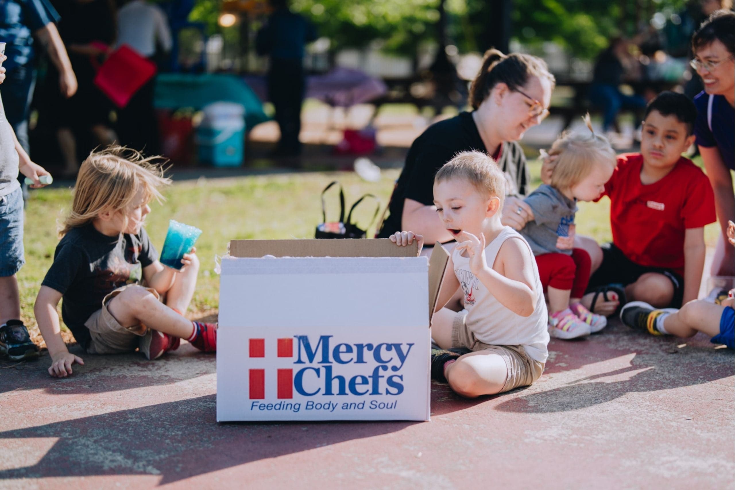 Two service members at Little Creek Naval Base receive Mercy Chefs' hot meals