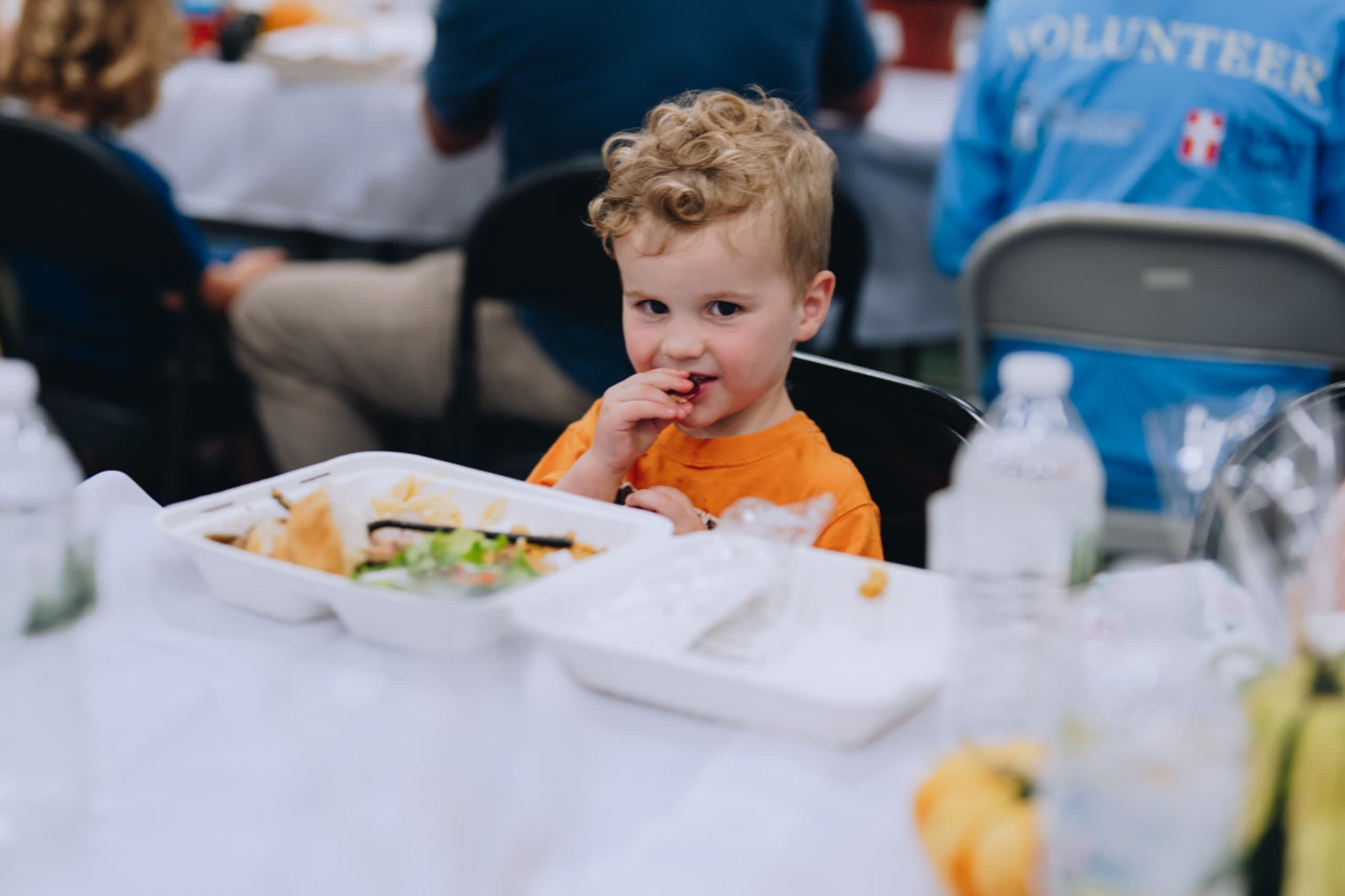 A boy enjoys a Mercy Chefs meal in North Carolina.